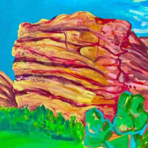 Vibrant red rock formations with green plants