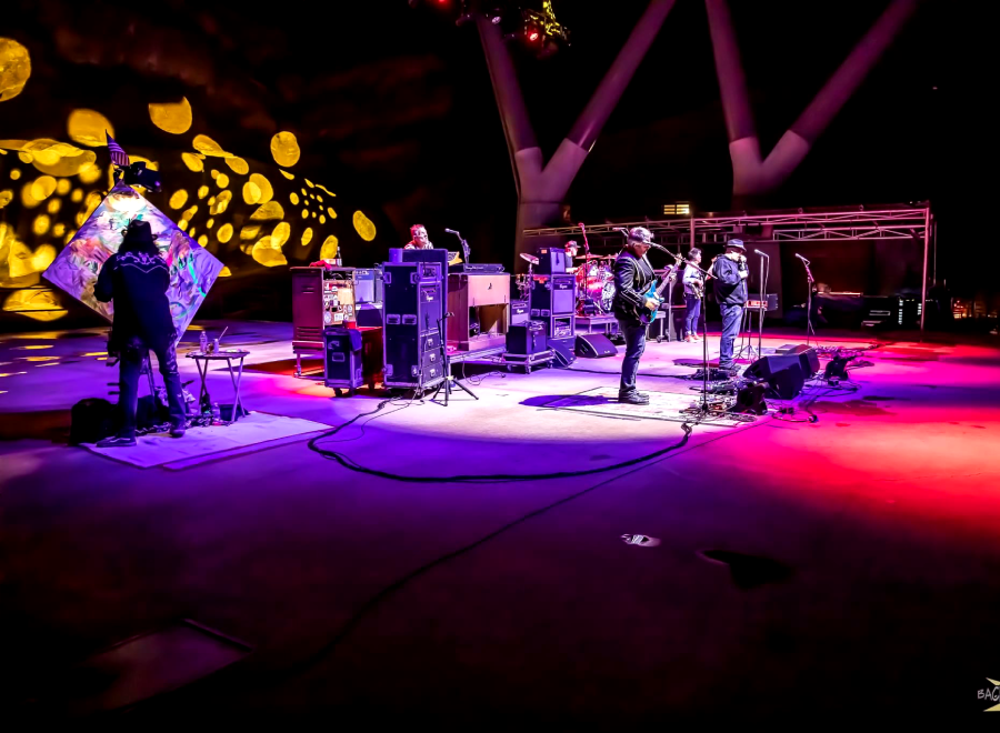 Live band performing on illuminated outdoor stage